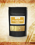 Black stand-up pouch of stone-ground yellow maize flour with a golden label showing product name and branding