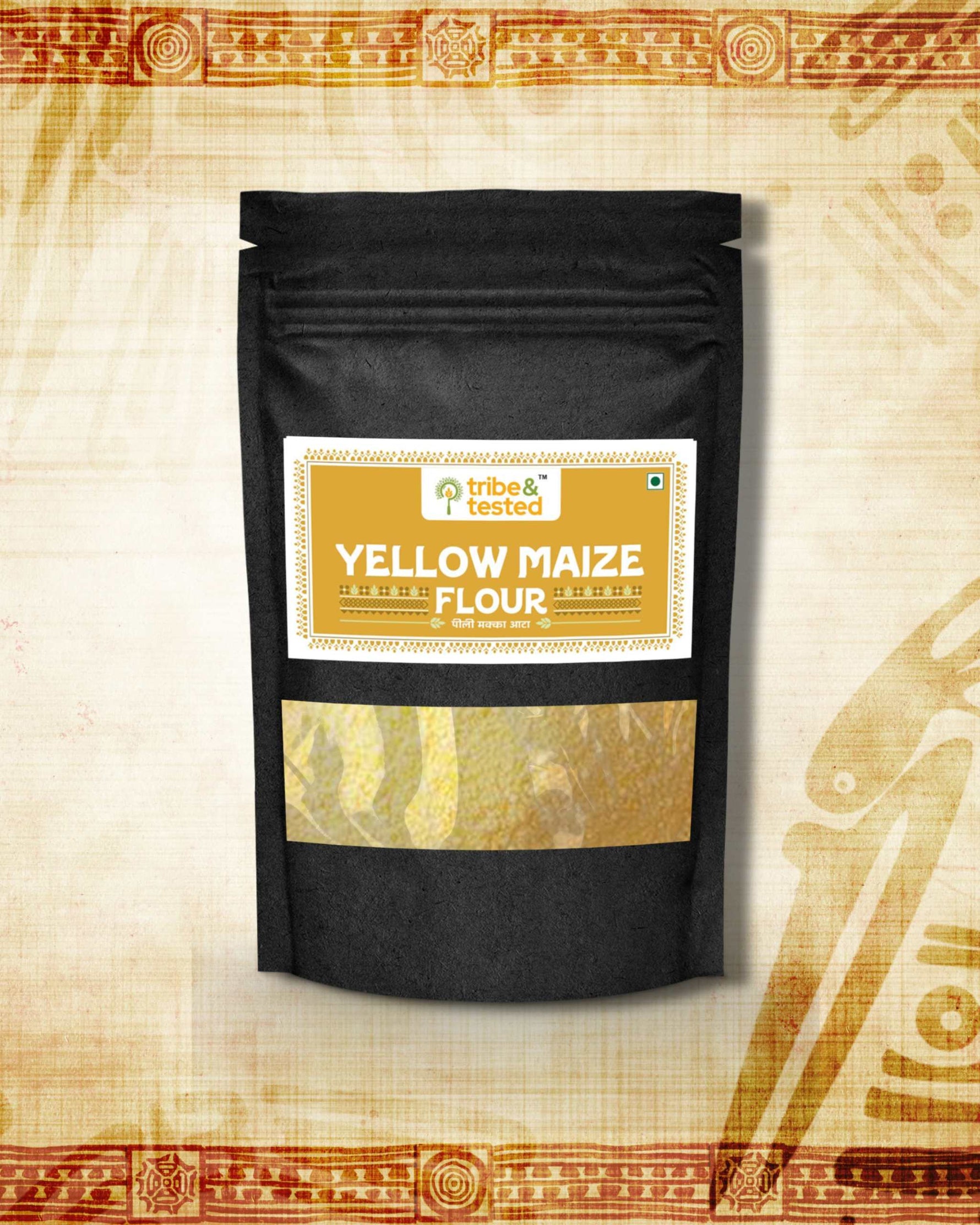 Black stand-up pouch of stone-ground yellow maize flour with a golden label showing product name and branding